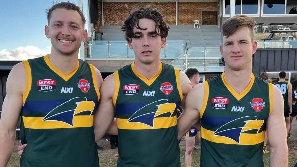 Shaun McNeilly (middle) with fellow CMS teammates Ben Edwards and Murphy Short. Picture: CMS Crows Football Club