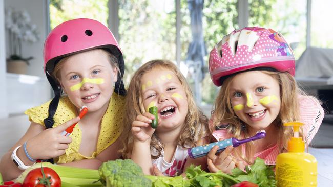 Sisters Kate, Annie, 3, and Maggie, 7, make sure they eat lots of fruit and veggies, brush their teeth and are aware of their safety. Picture: Sarah Matray