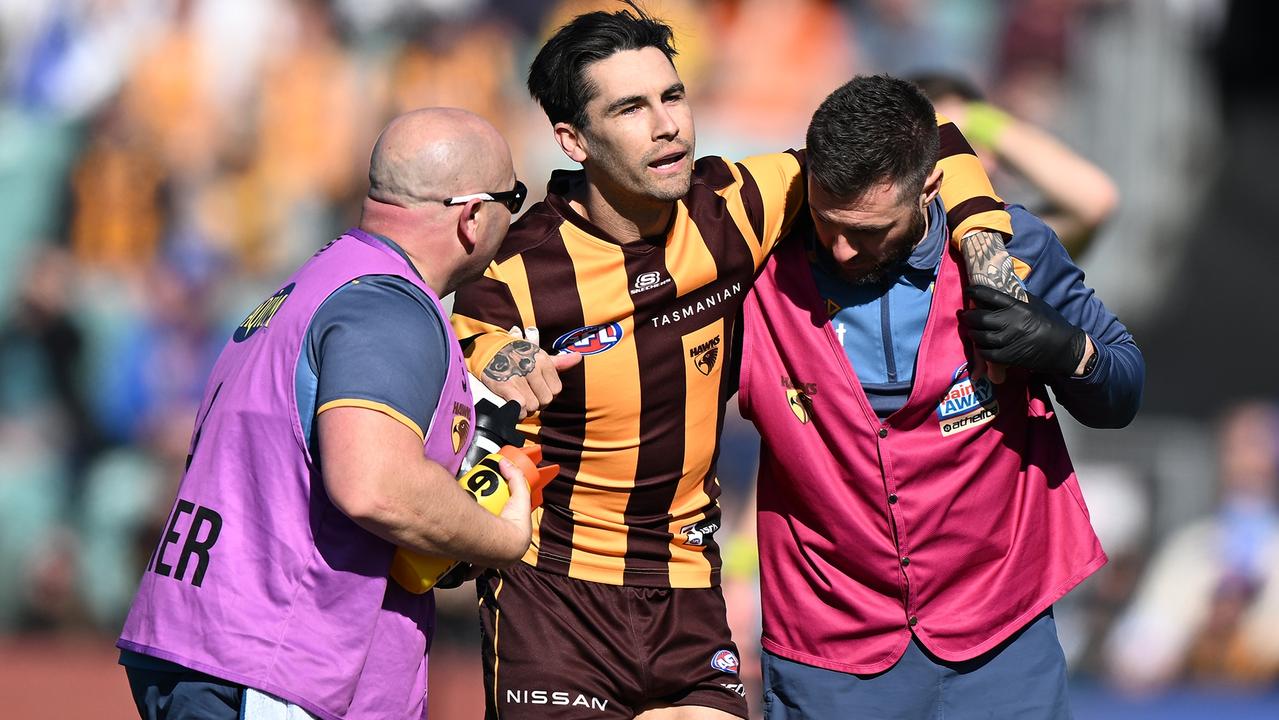 LAUNCESTON, AUSTRALIA - AUGUST 13: Chad Wingard is helped from the field after being injured during the round 22 AFL match between Hawthorn Hawks and Western Bulldogs at University of Tasmania Stadium, on August 13, 2023, in Launceston, Australia. (Photo by Steve Bell/Getty Images)