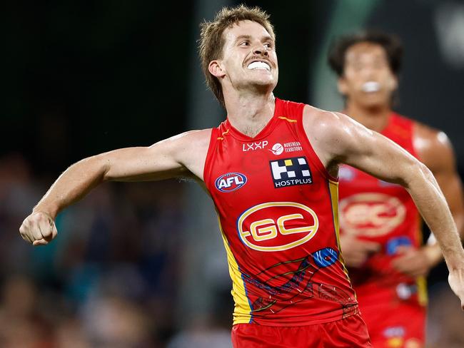 Noah Anderson celebrates a goal for Gold Coast. Picture: Michael Willson/AFL Photos via Getty Images