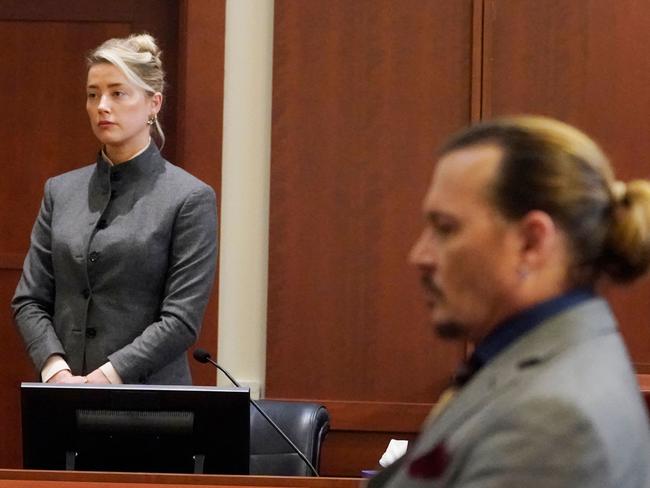 US actors Amber Heard and Johnny Depp watch as the jury leaves the courtroom at the end of the day at the Fairfax County Circuit Courthouse in Fairfax, Virginia, May 16, 2022. Picture: Steve Helber / AFP.