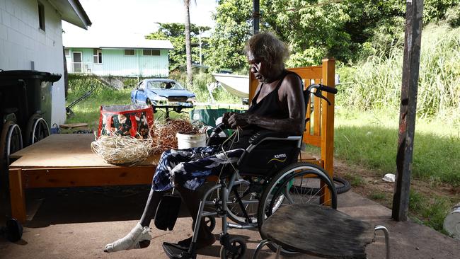 69-year-old Aunty Maureen Karyuka weeaves pandanus leaves into patterns on the front portch in Aurukun, a small Indigenous town on the Gulf of Carpentaria, 800 kilometers north northwest of Cairns on Cape York in Far North Queensland. Picture: Brendan Radke