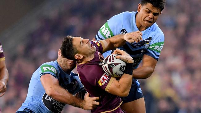 Billy Slater is crunched in a tackle by Boyd Cordner and Latrell Mitchell. Picture: AAP