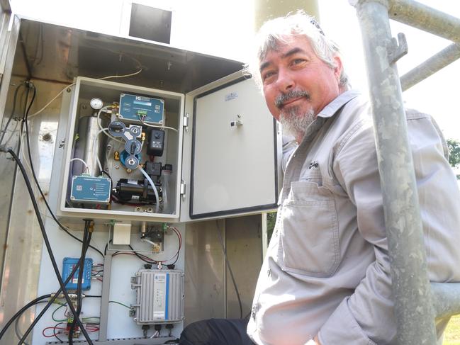 Bureau of Meteorology technician Alex Hoy attached to the Observing Operations Hub Cairns at the refitted Barron River flood height monitoring station in Kamerunga. Picture: Peter Carruthers