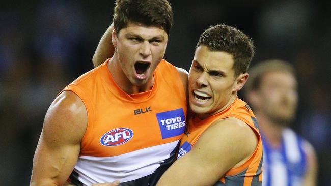 The Giants’ Jonathon Patton (left) celebrates a goal against North Melbourne on Saturday.