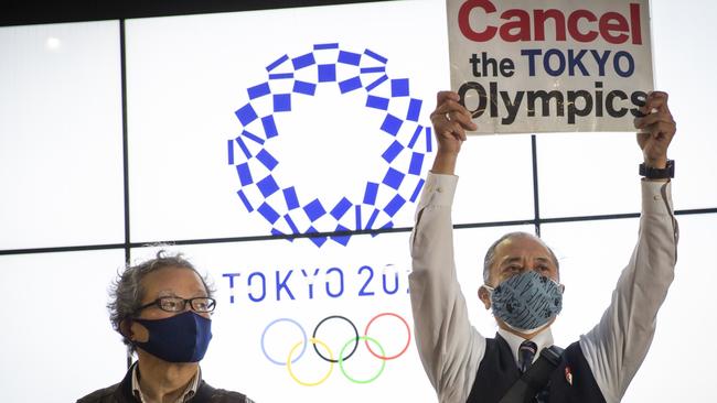 A protester holds a placard during a protest against the Tokyo Olympics on May 17. Picture: Yuichi Yamazaki/Getty Images