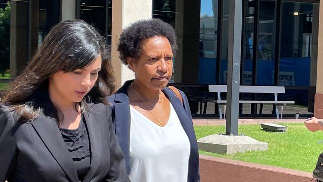 Dr Mary Anderson (white shirt) leaves the Cairns courthouse complex on August 16 after giving evidence at a coronial inquest into the rheumatic fever related deaths of three Doomadgee women in 2019. Picture: Peter Carruthers