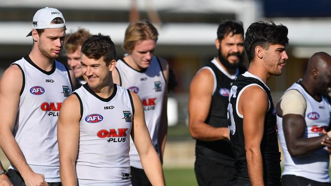 Port Adelaide Power players train at Alberton Oval on Thursday. Picture: AAP Image/David Mariuz