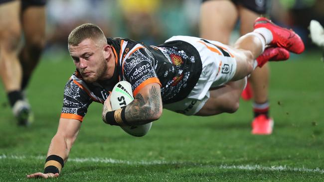 Tigers Sam McIntyre scores a try during the Wests Tigers v Warriors NRL match at the SCG. Picture: Brett Costello