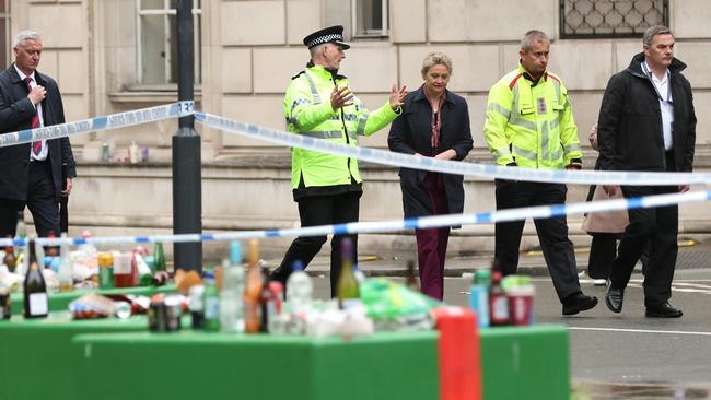 British Home Secretary Yvette Cooper speaks with Deputy Chief Constable Chris Green and Steve Rotheram, Mayor of the Liverpool City Region, as they walk from the incident area. Picture: Getty Images.