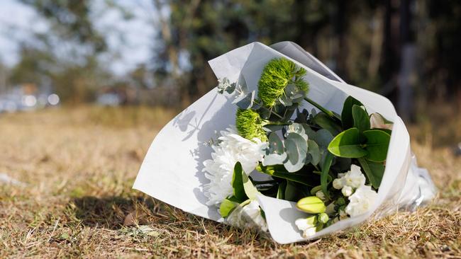 Flowers left at the crash site on Monday. Picture: David Swift