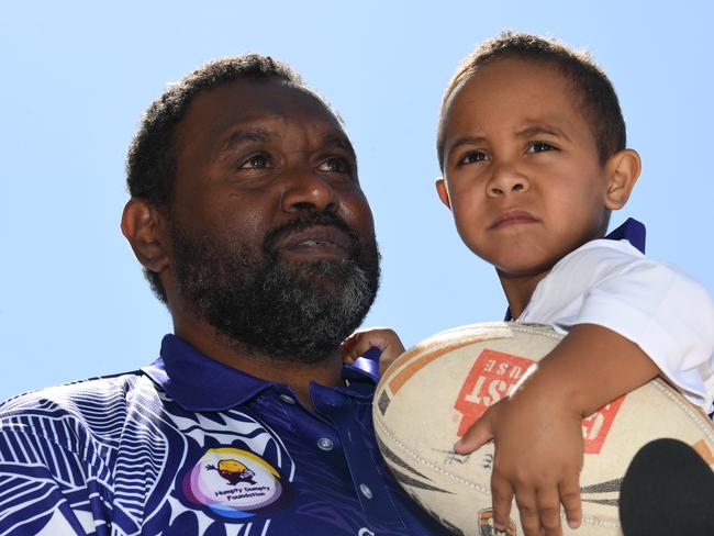 Moses Wigness and son, Moses Wigness Jr wearing their Humpty Doo Foundation fundraiser jerseys. Picture: (A)manda Parkinson