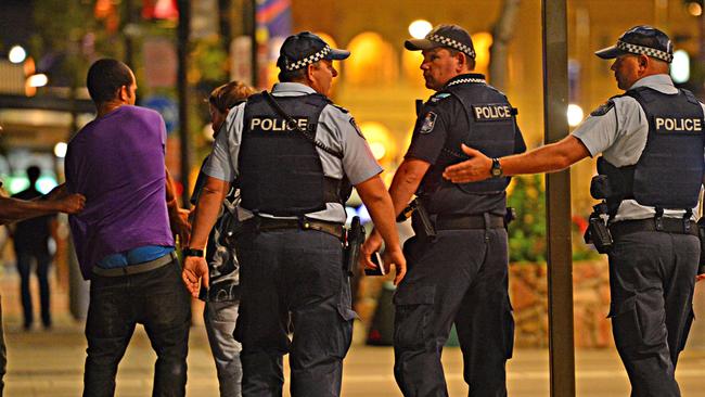 Police deal with an intoxicated patron on the Flinders Street. Picture: Zak Simmonds