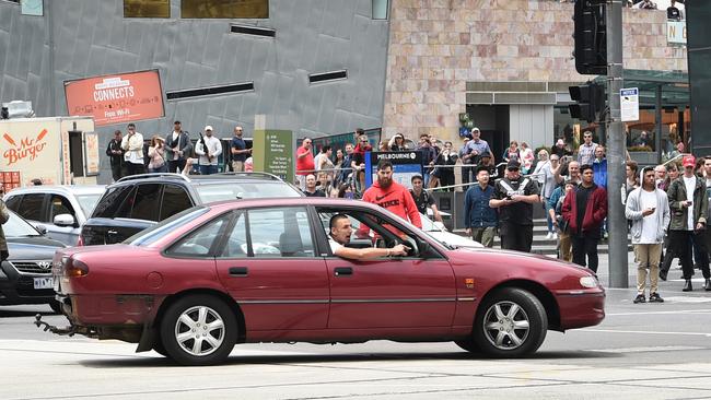 Police could only stand by and watch Jimmy Gargasoulas, 26, moments before he ploughed into shoppers in Bourke Street. (Pic: Tony Gough/News Corp Australia)