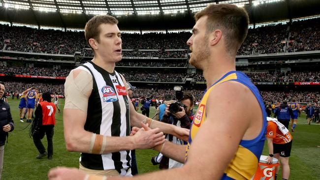 Collingwood's Mason Cox and West Coast's Scott Lycett after Saturday’s grand final at the MCG. Picture: Michael Klein