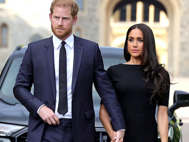 WINDSOR, ENGLAND - SEPTEMBER 10: Prince Harry, Duke of Sussex, and Meghan, Duchess of Sussex on the long Walk at Windsor Castle arrive to view flowers and tributes to HM Queen Elizabeth on September 10, 2022 in Windsor, England. Crowds have gathered and tributes left at the gates of Windsor Castle to Queen Elizabeth II, who died at Balmoral Castle on 8 September, 2022. (Photo by Chris Jackson/Getty Images)