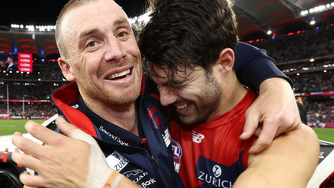 PERTH. 25/09/2021. AFL Grand Final.  Melbourne vs Western Bulldogs at Optus Stadium, Perth.  . Simon Goodwin, senior coach of the Demons hugs Christian Petracca of the Demons  after siren    . Photo by Michael Klein