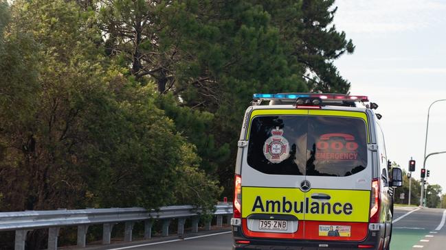 A woman is trapped after her car crashed into a pole west of Brisbane.