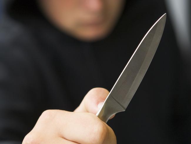 Generic image of a teenage boy brandishing a knife. Thinkstock image.