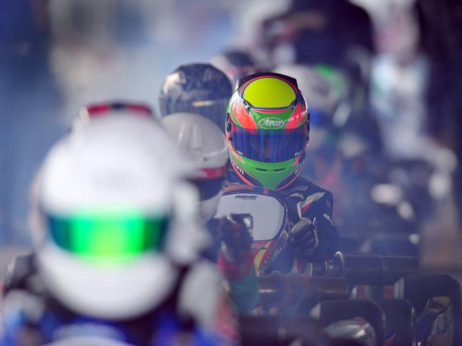 RACE READY: Drivers in the Junior National Lights hit the track in a cloud of smoke for practice at the QLD Championships.Photo Ben Turnbull / NewsMail