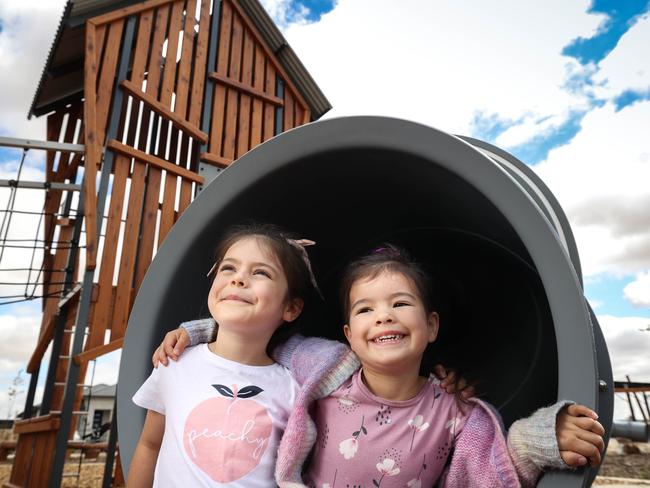 Maya Pooley, 6 (t-shirt), with sister Cleo, 4 (cardigan), at Freedom Park - in Hickinbotham Group's Liberty housing estate in Two Wells. Supplied by Hickinbotham Group