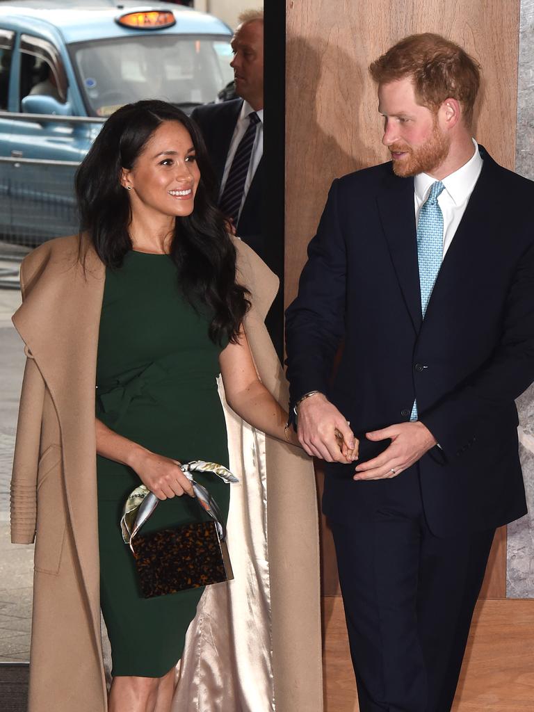 Meghan wore a slim, green dress with a camel-coloured coat. Picture: Stuart C Wilson/Getty Images