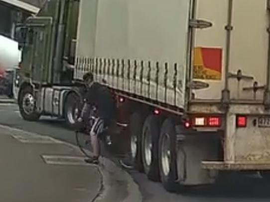 A cyclist had a close encounter with a truck in Melbourne's Docklands. Picture: Dash Cam Owners Australia