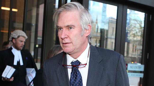 Fair Work Vice President and Kathy Jackson's partner Michael Lawlor leaves the Federal court in Sydney after the days proceedings.