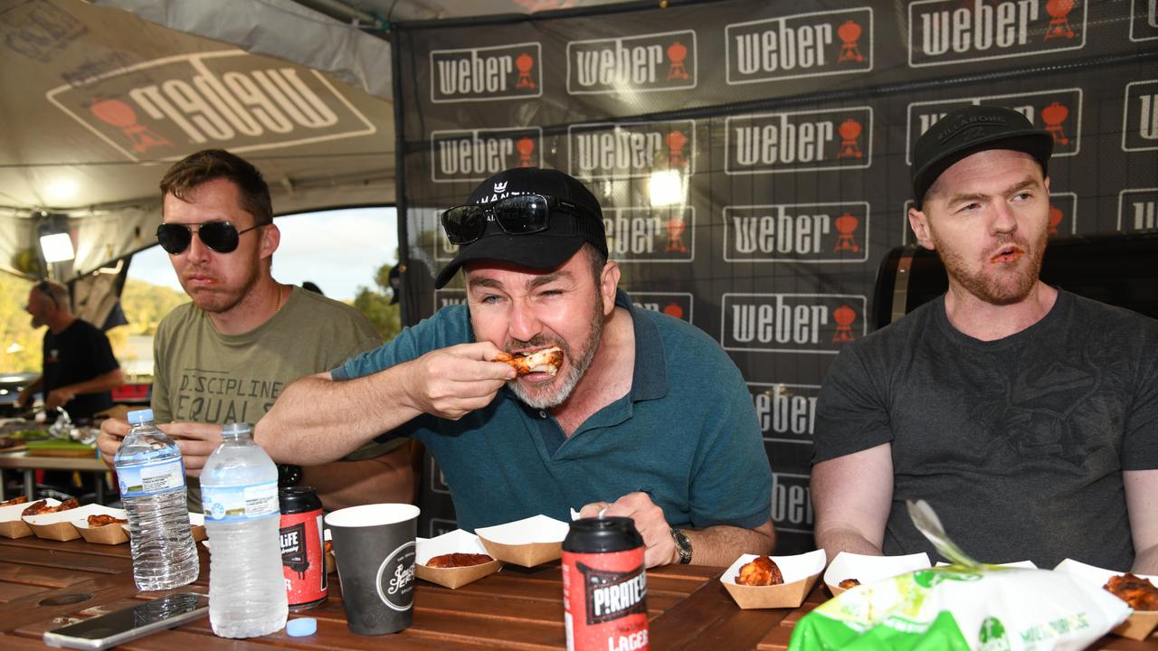 Adam Hamilton, Matt Diesel and Madison Rodier take part in the Weber Chilli tasting competition. Meatstock Festival at the Toowoomba showgrounds. April 2022