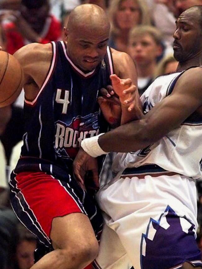 Houston Rockets' Charles Barkley is blocked by Utah Jazz's Karl Malone.