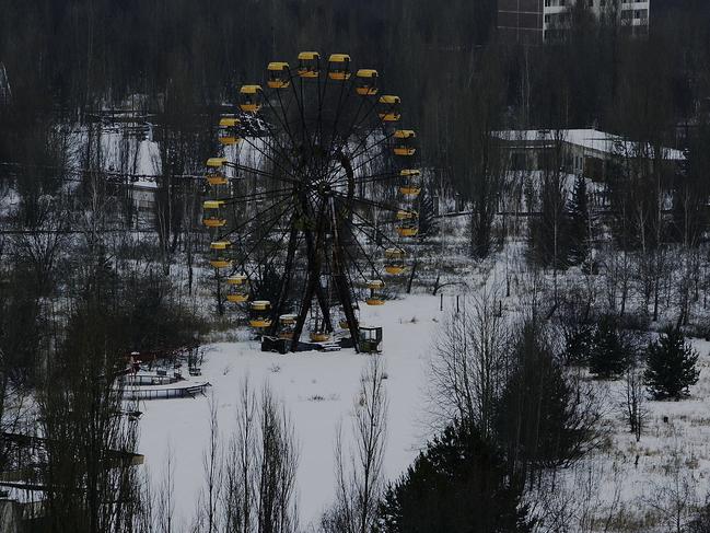 An abandoned ferris wheel is seen in a childrens fairground in the town of Pripyat on January 25, 2006 near Chernobyl, Ukraine. Picture: Daniel Berehulak/Getty Images