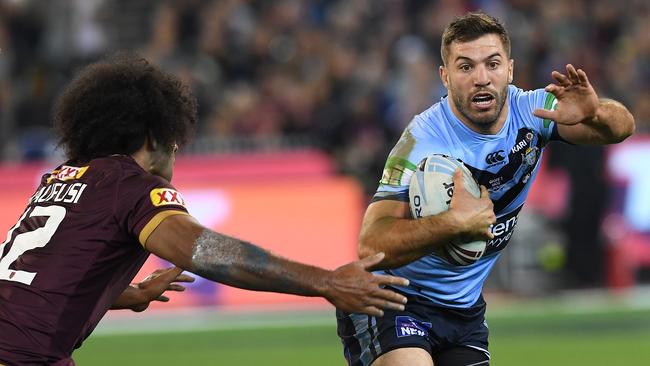 James Tedesco of the Blues (right) and Felise Kaufusi of the Maroons are seen in action during Game 1 of the 2018 State of Origin series at the MCG in Melbourne, Wednesday, June 6, 2018. (AAP Image/Julian Smith) NO ARCHIVING, EDITORIAL USE ONLY