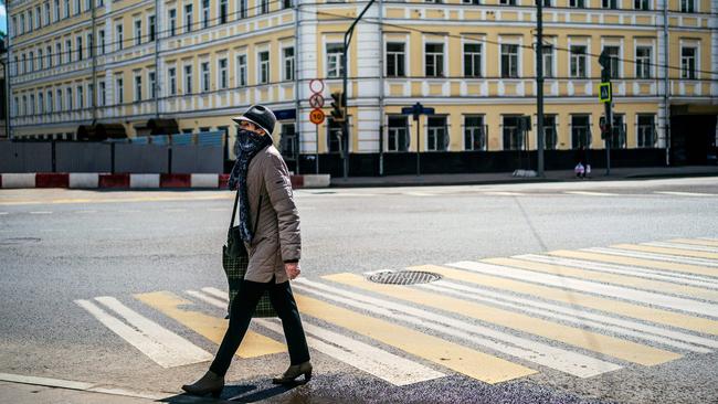 A woman walks across a street in Moscow. Picture: AFP