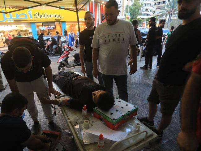 A man donates blood under a tent in Beirut's southern suburbs. Picture: AFP