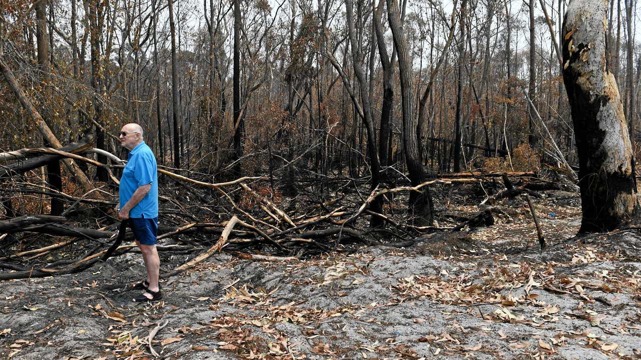 Geoff MacOibicin stands at his home where fire threatened homes at Wardell when it pushed right up to the back of properties at Lindsay Crescent. Picture: Marc Stapelberg