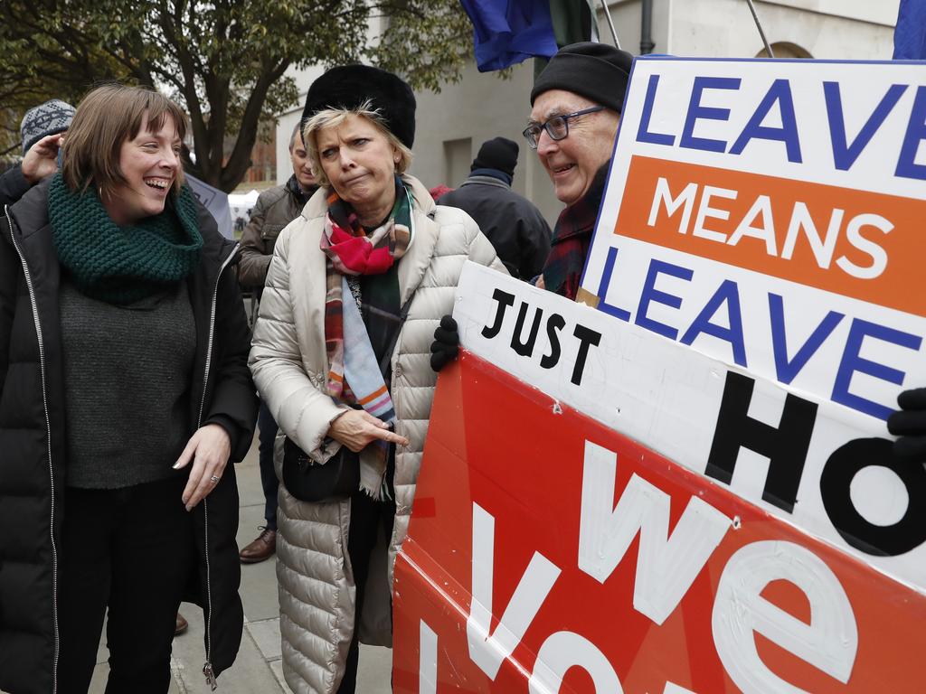 Remainer MP Anna Soubry, centre, with pro-Brexit protesters. Picture: AP/Alastair Grant