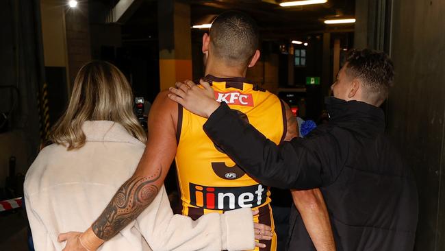 Shaun Burgoyne leaves the field after his 400th match with wife Amy and son Ky.