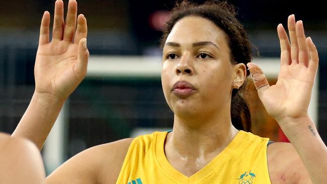 RIO DE JANEIRO, BRAZIL - AUGUST 11:  Marianna Tolo #14 and Elizabeth Cambage #8 of Australia celebrate against Japan during a Women's Preliminary Group B match on Day 6 of the Rio 2016 Olympics at the Youth Arena on August 11, 2016 in Rio de Janeiro, Brazil.  (Photo by Sean M. Haffey/Getty Images)