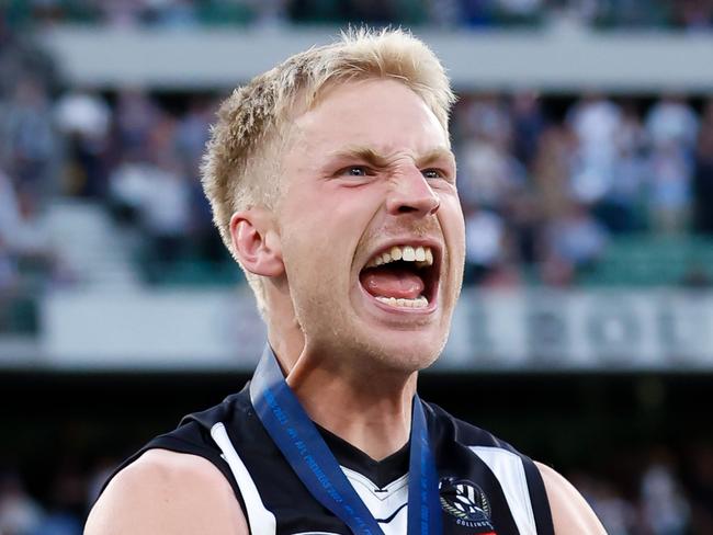 MELBOURNE, AUSTRALIA - SEPTEMBER 30: Billy Frampton of the Magpies celebrates after receiving his premiership medal during the 2023 AFL Grand Final match between the Collingwood Magpies and the Brisbane Lions at the Melbourne Cricket Ground on September 30, 2023 in Melbourne, Australia. (Photo by Dylan Burns/AFL Photos via Getty Images)