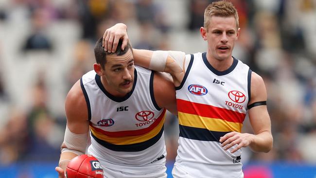 Taylor Walker, left, and David Mackay on Saturday. Picture: Michael Willson/AFL Photos via Getty Images