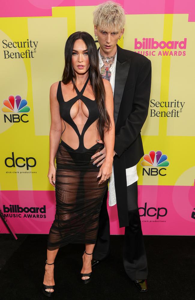 All eyes on her: Megan Fox looks on as Machine Gun Kelly accepts the top rock artist award at the Billboard Music Awards on Sunday, May 23, 2021. Picture: Rich Fury/Getty Images