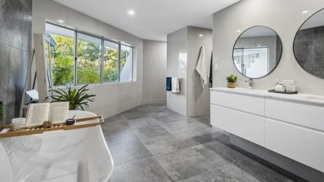 The lavish bathroom looks like something straight out of Grand Designs.