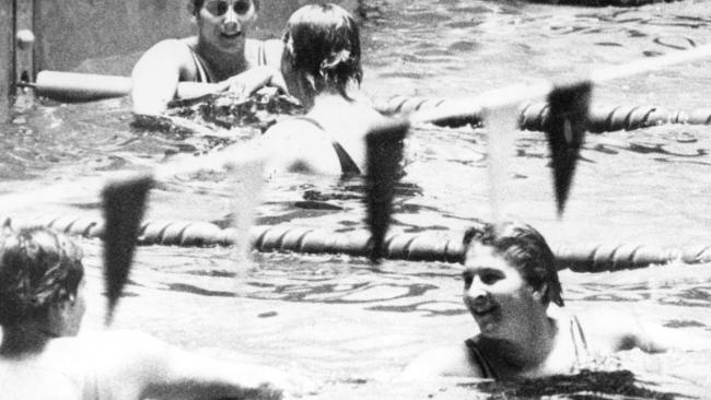 Stroke of genius: Dawn Fraser being congratulated after setting a new Olympic record to win the women's 100m freestyle final in Tokyo.