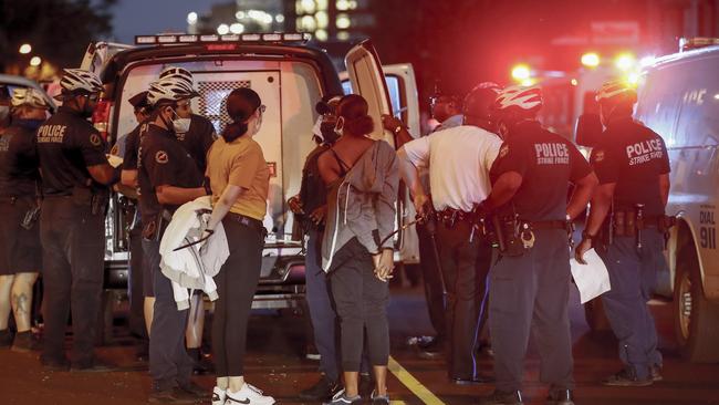 Police detain people in Philadelphia.