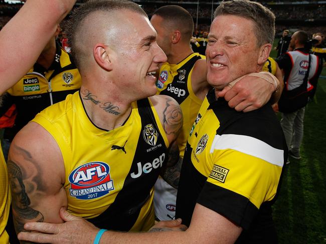 MELBOURNE, AUSTRALIA - SEPTEMBER 30: Dustin Martin of the Tigers and Damien Hardwick, Senior Coach of the Tigers celebrate during the 2017 Toyota AFL Grand Final match between the Adelaide Crows and the Richmond Tigers at the Melbourne Cricket Ground on September 30, 2017 in Melbourne, Australia. (Photo by Michael Willson/AFL Media/Getty Images)