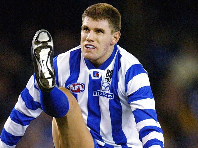 09/06/2003 PIRATE: 06/06/2003. Jason McCartney kicks a goal during his comeback / retirement match against Richmond. Kangaroos v Richmond at Telstra Dome. Digital Image. PUBLISHED 14/06/2003 PAGE 40.  HS25