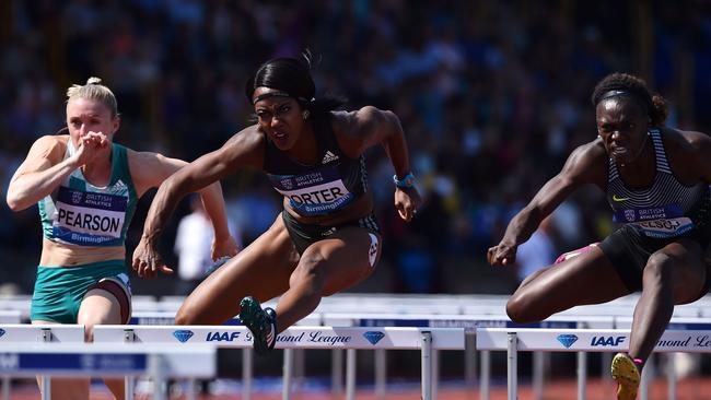 Australia's Sally Pearson, Britain's Tiffany Porter and US athlete Dawn Harper-Nelson compete in the women's 100-metres hurdles.