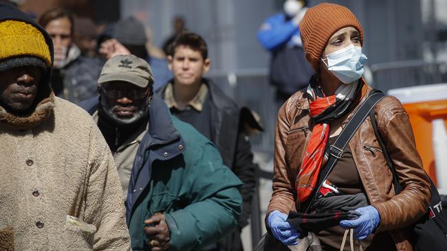 New York citizens wait in line for food at the Bowery Mission in New York. Picture: AP