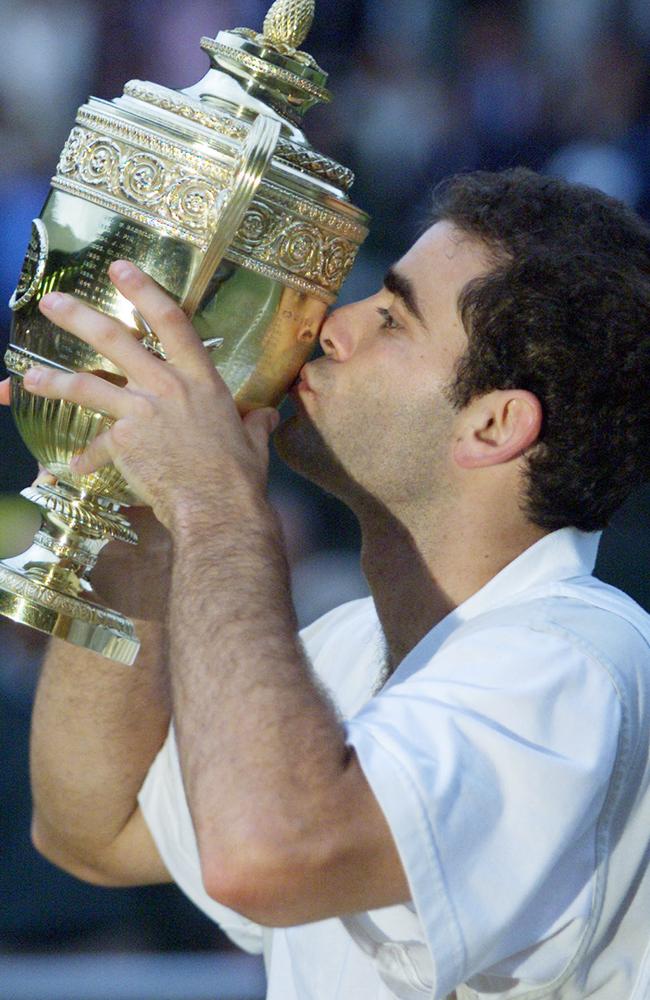 Tennis player Pete Sampras kissing trophy after winning Wimbledon Championship men's singles final match 09 July 2000. rafter/sampras/match