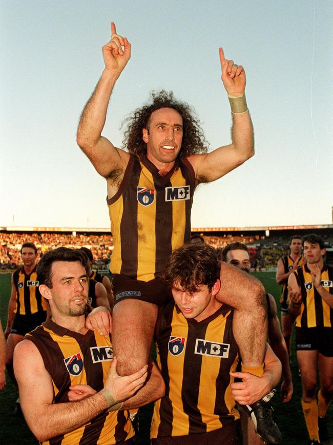 John Platten carried by Daniel Harford with Tony Woods after his 250th game, against Port Adelaide at Waverly Park.